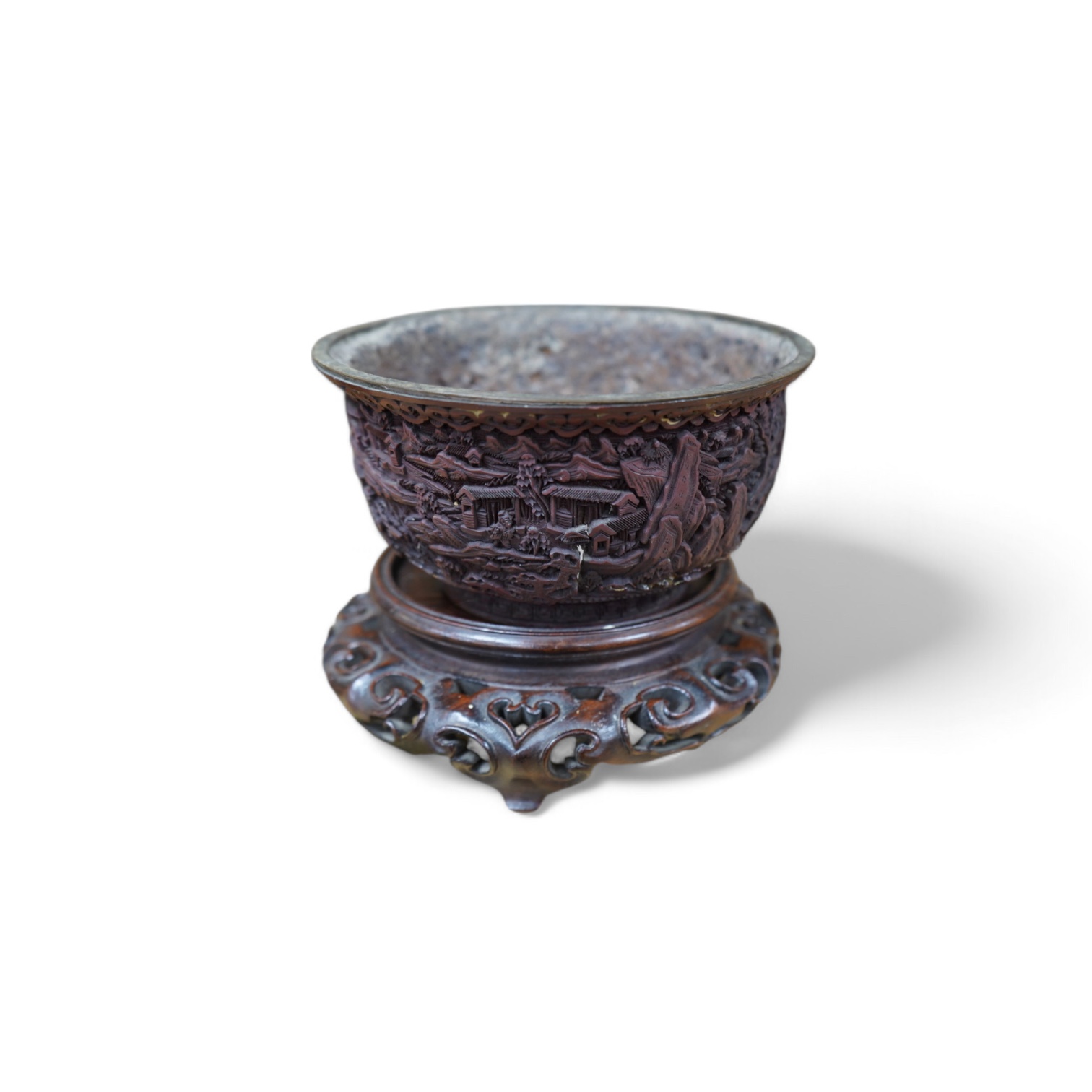 An 18th/19th century Chinese cinnabar lacquer bowl, on carved hongmu stand and a Chinese pierced brass disc. Condition - poor